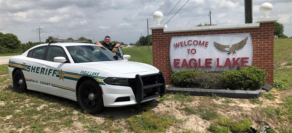 Eagle Lake deputy standing at patrol car